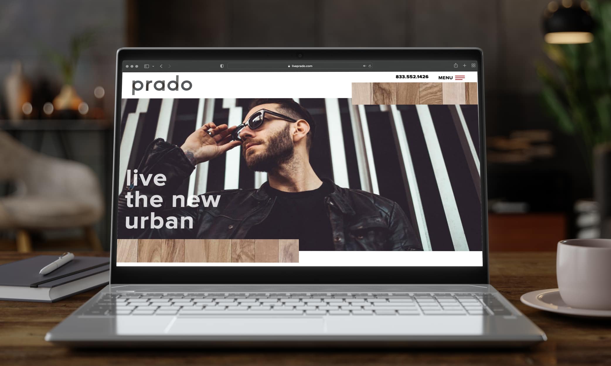 Prado website home page on laptop screen. High contrast image of man in sunglass and striking black and white background.